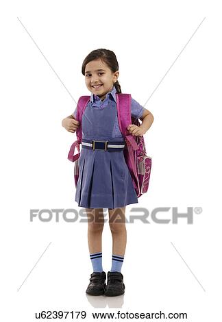 Portrait of a young school girl smiling View Large Photo Image Stock Photo - Portrait of a young school girl smiling . Fotosearch