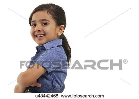 Stock Photography - Portrait of a young school girl smiling . Fotosearch