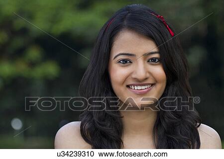 Portrait of a young woman View Large Photo Image Stock Image - Portrait of a young woman . Fotosearch
