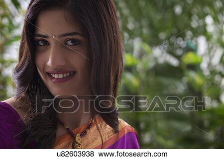 Portrait of a young woman View Large Photo Image Stock Photo - Portrait of a young woman . Fotosearch