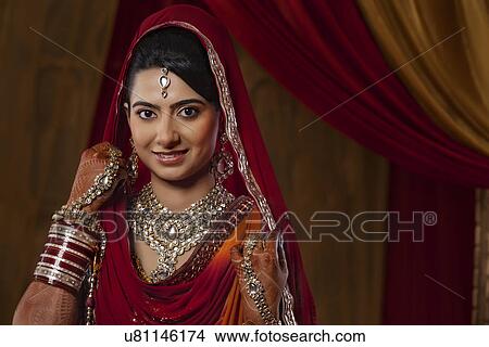 Portrait of an Indian bride looking down View Large Photo Image Picture - Portrait of an Indian bride looking down . Fotosearch