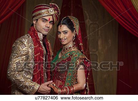 Portrait of beautiful couple holding hands View Large Photo Image Stock Photograph - Portrait of beautiful couple holding hands . Fotosearch