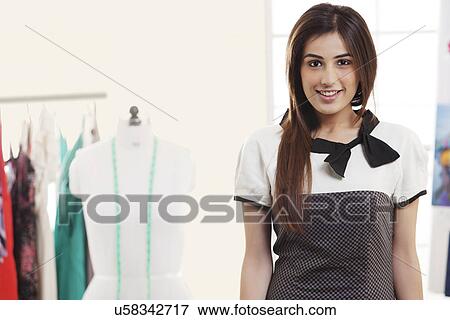 Portrait of beautiful fashion designer smiling View Large Photo Image Stock Photo - Portrait of beautiful fashion designer smiling . Fotosearch