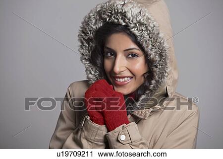 Portrait of beautiful young lady over grey background View Large Photo Image Stock Image - Portrait of beautiful young lady over grey background . Fotosearch