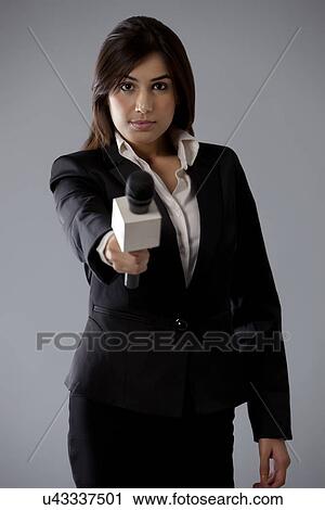 Portrait of beautiful young reporter asking comment View Large Photo Image Stock Image - Portrait of beautiful young reporter asking comment . Fotosearch