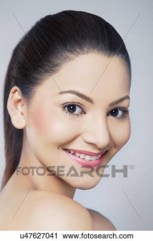 Portrait of beautiful young woman smiling View Large Photo Image Stock Image - Portrait of beautiful young woman smiling . Fotosearch