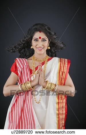 Stock Image - Portrait of Bengali woman greeting . Fotosearch