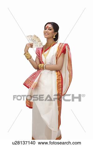 Stock Image - Portrait of Bengali woman holding currency notes . Fotosearch