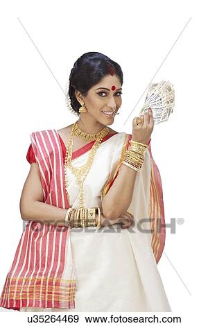 Portrait of Bengali woman holding currency View Large Photo Image Stock Photo - Portrait of Bengali woman holding currency. Fotosearch