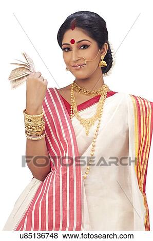 Stock Photo - Portrait of Bengali woman holding currency notes. Fotosearch
