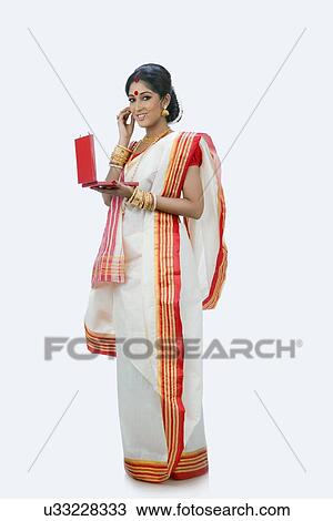 Stock Image - Portrait of Bengali woman with a jewelery box. Fotosearch