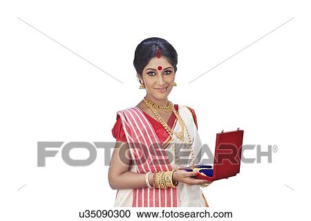 Stock Image - Portrait of Bengali woman with a jewelery box. Fotosearch
