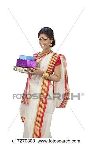 Stock Image - Portrait of Bengali woman with gifts. Fotosearch