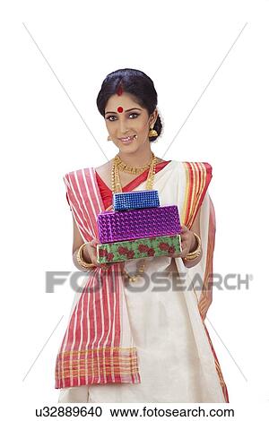 Stock Image - Portrait of Bengali woman with gifts . Fotosearch