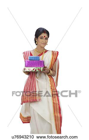Stock Image - Portrait of Bengali woman with gifts. Fotosearch
