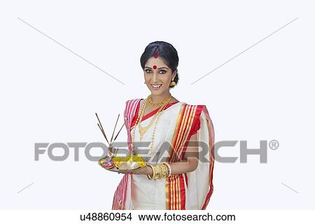 Picture - Portrait of Bengali woman with puja thali. Fotosearch