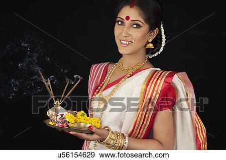 Portrait of Bengali woman with puja thali View Large Photo Image Stock Photo - Portrait of Bengali woman with puja thali . Fotosearch