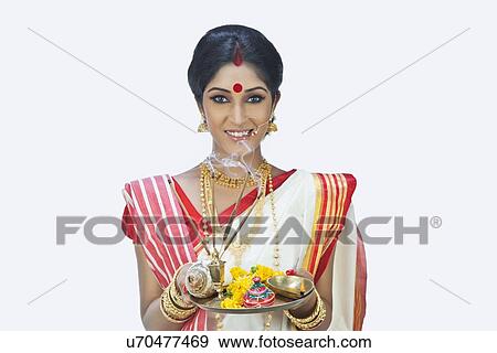 Portrait of Bengali woman with puja thali View Large Photo Image Stock Photo - Portrait of Bengali woman with puja thali. Fotosearch