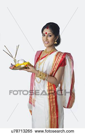 Portrait of Bengali woman with puja thali View Large Photo Image Stock Photography - Portrait of Bengali woman with puja thali. Fotosearch