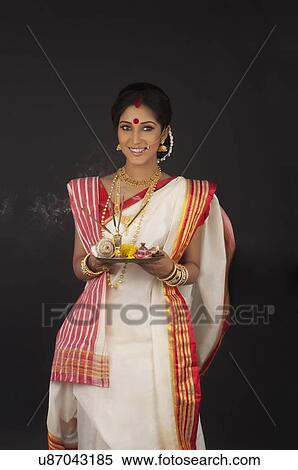 Stock Photography - Portrait of Bengali woman with puja thali. Fotosearch