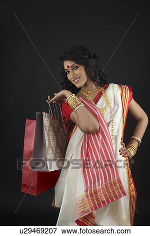 Portrait of Bengali woman with shopping bags View Large Photo Image Stock Photo - Portrait of Bengali woman with shopping bags . Fotosearch