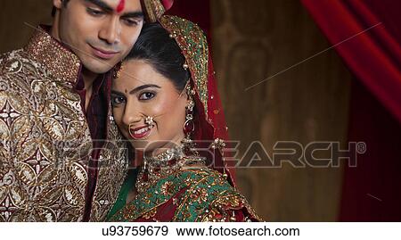 Portrait of bride resting her head on man's shoulder View Large Photo Image Stock Photo - Portrait of bride resting her head on man's shoulder . Fotosearch