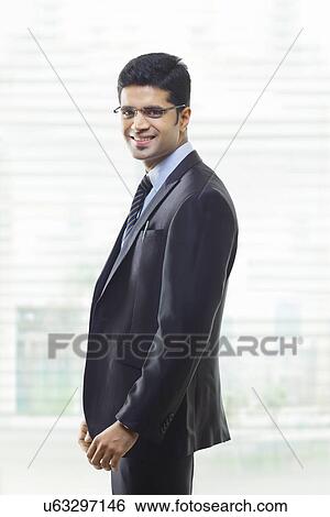 Stock Photograph - Portrait of businessman smiling . Fotosearch