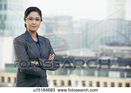 Portrait of businesswoman with arms folded View Large Photo Image Stock Image - Portrait of businesswoman with arms folded . Fotosearch