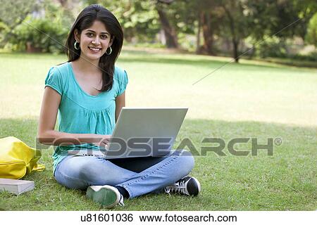 Portrait of college student using laptop View Large Photo Image Stock Photograph - Portrait of college student using laptop . Fotosearch