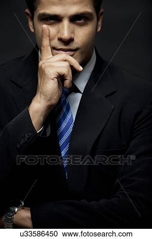 Portrait of confident business man with confident smile View Large Photo Image Stock Image - Portrait of confident business man with confident smile . Fotosearch
