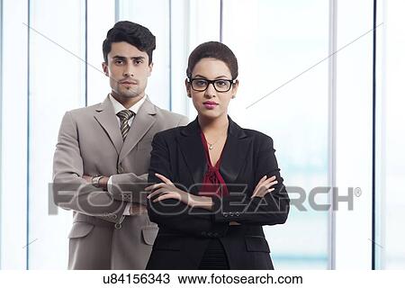 Stock Image - Portrait of confident business people in office. Fotosearch