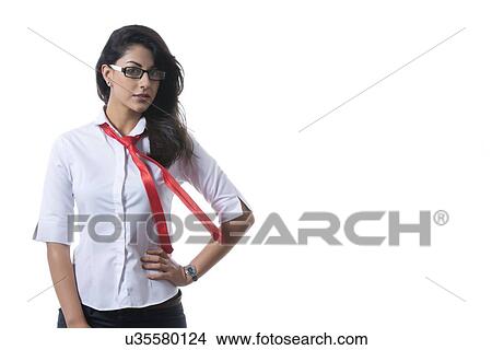 Portrait of confident fashionable businesswoman wearing glasses over white background View Large Photo Image Picture - Portrait of confident fashionable businesswoman wearing glasses over white background. Fotosearch