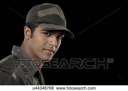 Stock Photo - Portrait of confident Indian soldier over black background . Fotosearch