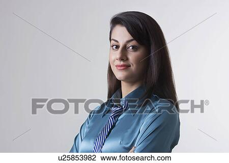 Portrait of confident Indian businesswoman over gray background View Large Photo Image Stock Image - Portrait of confident Indian businesswoman over gray background. Fotosearch