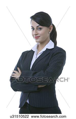 Portrait of confident well-dressed businesswoman with arms crossed over white background View Large Photo Image Stock Image - Portrait of confident well-dressed businesswoman with arms crossed over white background. Fotosearch
