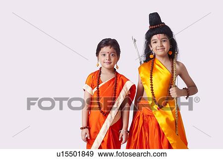 Portrait of cute children dressed as Ram and Sita against white background View Large Photo Image Stock Photo - Portrait of cute children dressed as Ram and Sita against white background. Fotosearch