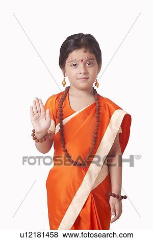 Portrait of cute girl dressed as Goddess Sita against white background View Large Photo Image Stock Photo - Portrait of cute girl dressed as Goddess Sita against white background. Fotosearch