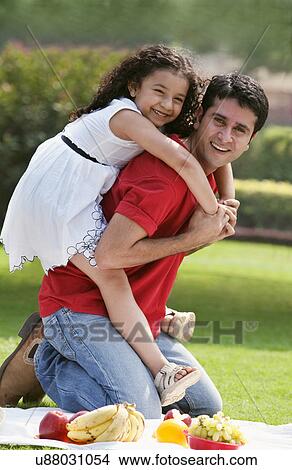 Portrait of father and daughter at a picnic View Large Photo Image Picture - Portrait of father and daughter at a picnic . Fotosearch
