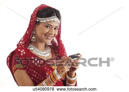 Stock Photo - Portrait of female dancer with a mobile phone . Fotosearch