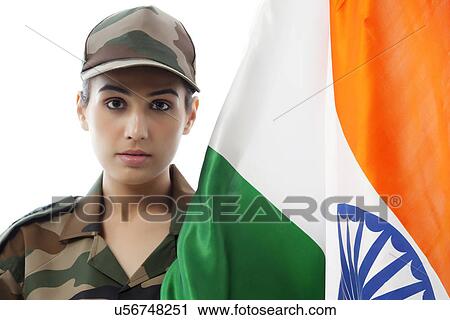 Stock Image - Portrait of female soldier with Indian flag against white background . Fotosearch