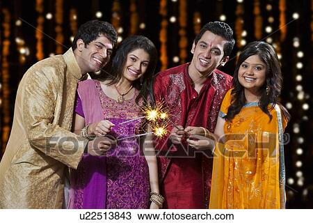Portrait of friends playing with firecrackers View Large Photo Image Stock Image - Portrait of friends playing with firecrackers. Fotosearch