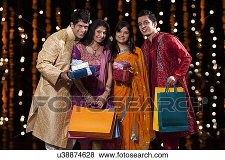 Portrait of friends with gifts and shopping bags View Large Photo Image Stock Photo - Portrait of friends with gifts and shopping bags. Fotosearch