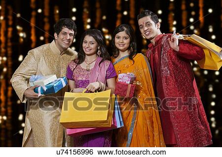 Portrait of friends with gifts and shopping bags View Large Photo Image Stock Photograph - Portrait of friends with gifts and shopping bags. Fotosearch