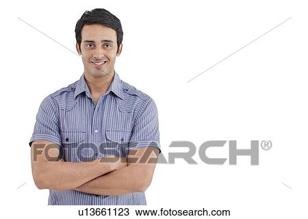 Portrait of handsome man with arms crossed View Large Photo Image Stock Image - Portrait of handsome man with arms crossed . Fotosearch