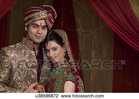 Stock Image - Portrait of happy couple smiling . Fotosearch