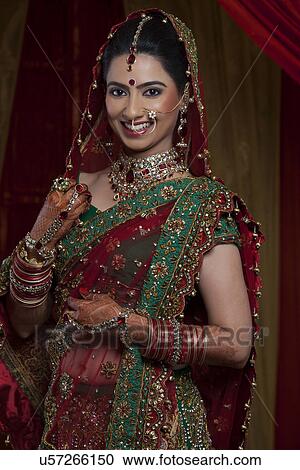 Portrait of happy young Indian bride View Large Photo Image Stock Image - Portrait of happy young Indian bride . Fotosearch