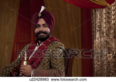 Portrait of Indian man holding sword View Large Photo Image Stock Image - Portrait of Indian man holding sword . Fotosearch