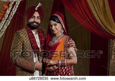 Portrait of mid adult couple smiling View Large Photo Image Stock Photography - Portrait of mid adult couple smiling . Fotosearch