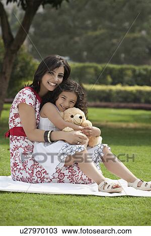 Stock Image - Portrait of mother and daughter . Fotosearch