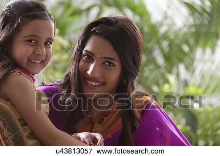 Stock Photo - Portrait of mother and daughter . Fotosearch